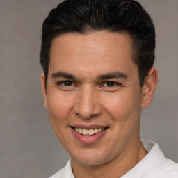 Joyful white adult male with short  brown hair and brown eyes