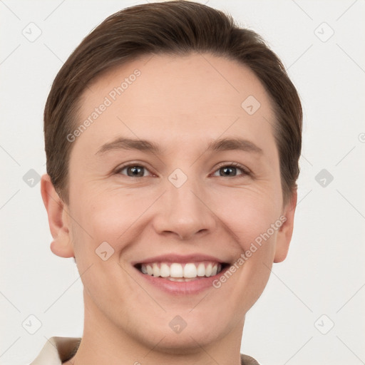 Joyful white young-adult female with short  brown hair and grey eyes