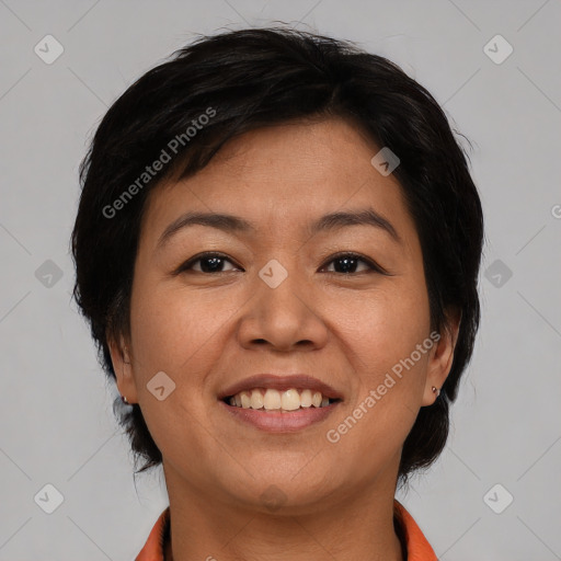 Joyful asian adult female with medium  brown hair and brown eyes