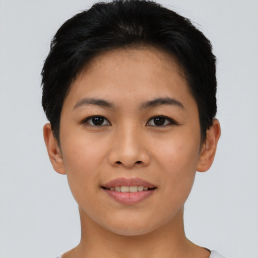 Joyful asian young-adult female with short  black hair and brown eyes