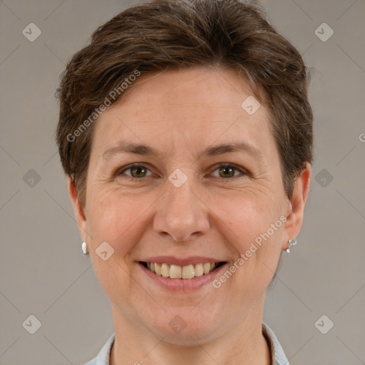 Joyful white adult female with short  brown hair and brown eyes