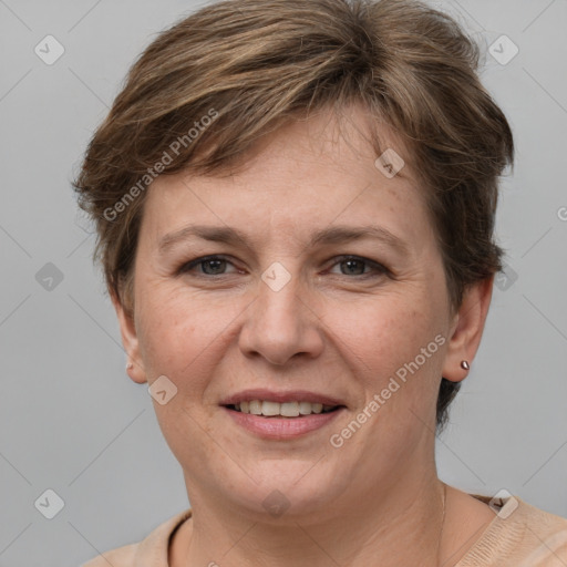 Joyful white adult female with short  brown hair and grey eyes