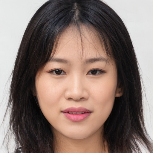 Joyful asian young-adult female with long  brown hair and brown eyes