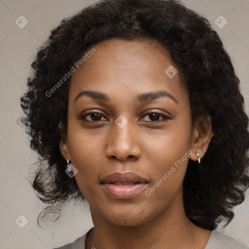 Joyful black young-adult female with medium  black hair and brown eyes