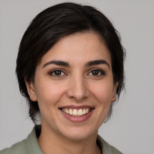 Joyful white young-adult female with medium  brown hair and brown eyes