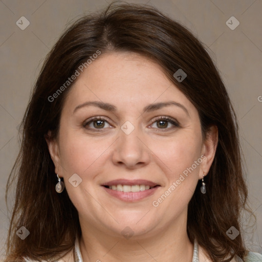 Joyful white adult female with medium  brown hair and grey eyes