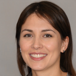 Joyful white young-adult female with medium  brown hair and brown eyes