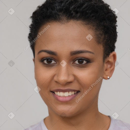 Joyful black young-adult female with short  brown hair and brown eyes