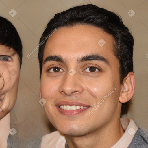 Joyful white young-adult male with short  black hair and brown eyes