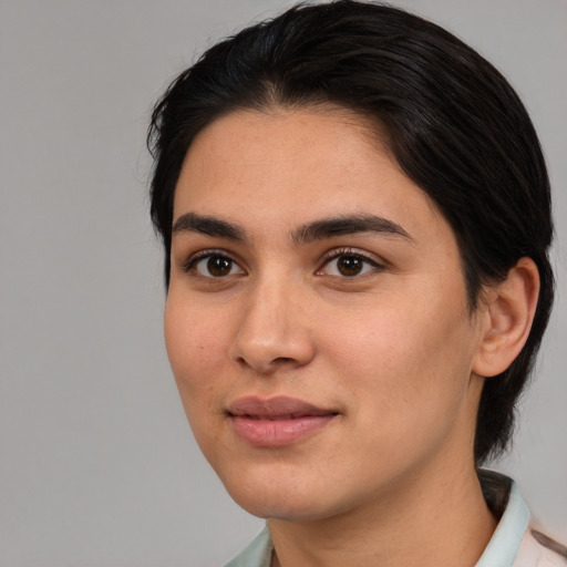 Joyful white young-adult female with medium  brown hair and brown eyes