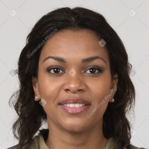 Joyful black young-adult female with long  brown hair and brown eyes