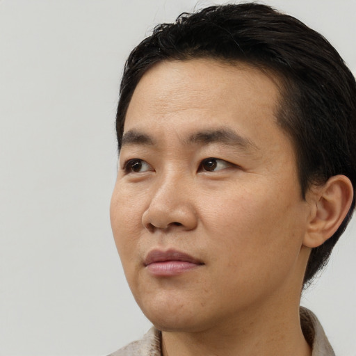 Neutral asian young-adult male with short  black hair and brown eyes
