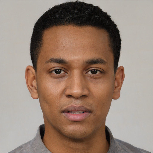 Neutral black young-adult male with short  black hair and brown eyes