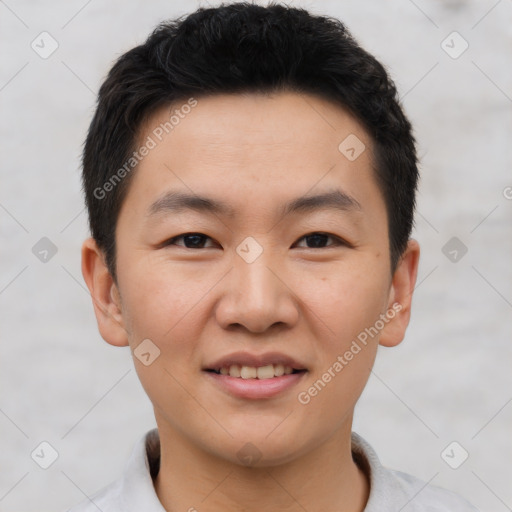 Joyful asian young-adult male with short  brown hair and brown eyes