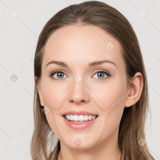 Joyful white young-adult female with long  brown hair and grey eyes