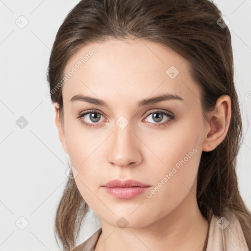 Neutral white young-adult female with long  brown hair and brown eyes