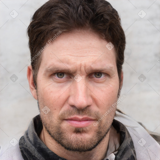 Joyful white adult male with short  brown hair and grey eyes