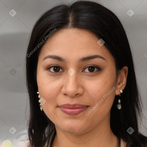 Joyful latino young-adult female with long  brown hair and brown eyes