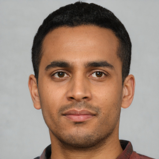 Neutral latino young-adult male with short  black hair and brown eyes