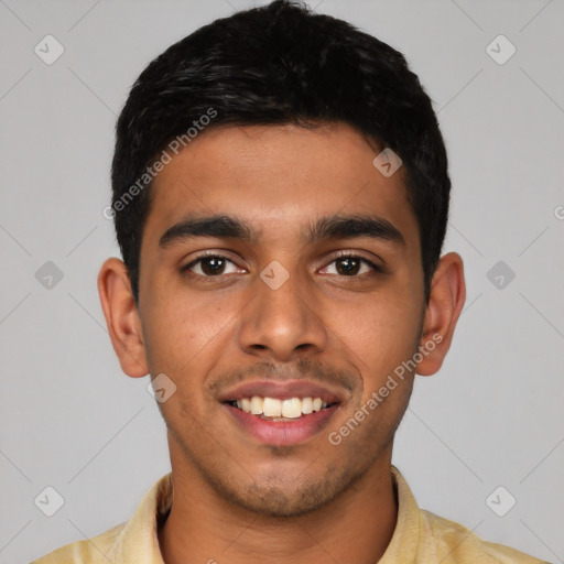 Joyful latino young-adult male with short  black hair and brown eyes