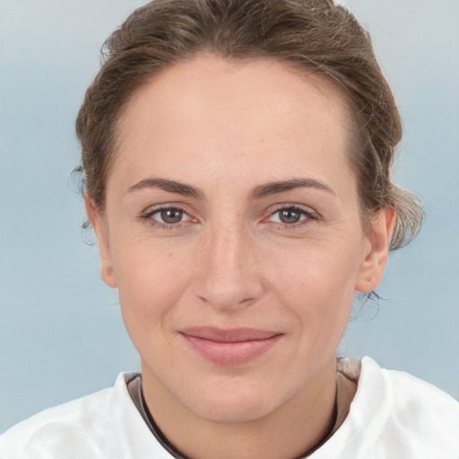 Joyful white adult female with short  brown hair and brown eyes