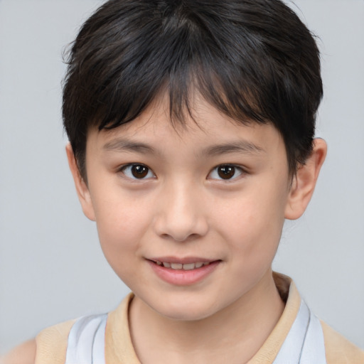 Joyful white child female with short  brown hair and brown eyes