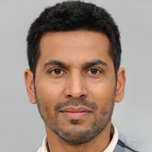 Neutral latino adult male with short  black hair and brown eyes