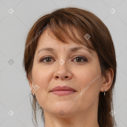 Joyful white adult female with medium  brown hair and brown eyes