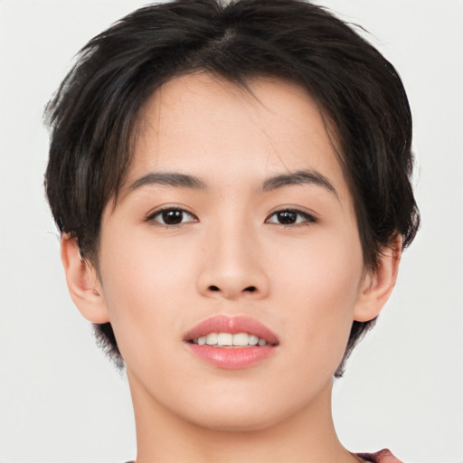 Joyful asian young-adult female with short  brown hair and brown eyes