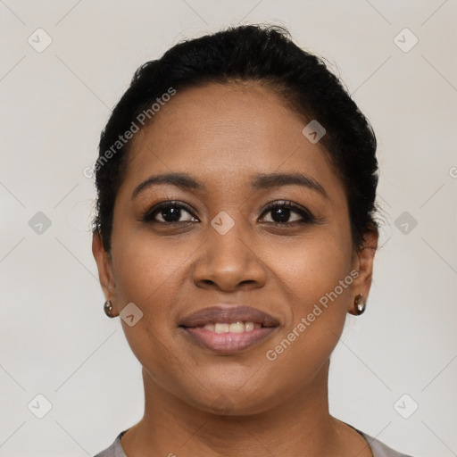 Joyful latino young-adult female with short  black hair and brown eyes