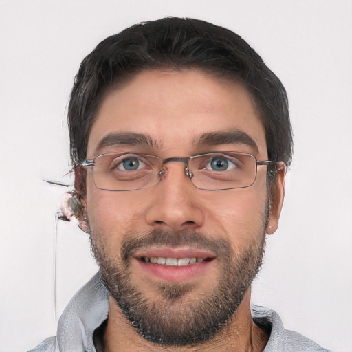 Joyful white young-adult male with short  black hair and brown eyes