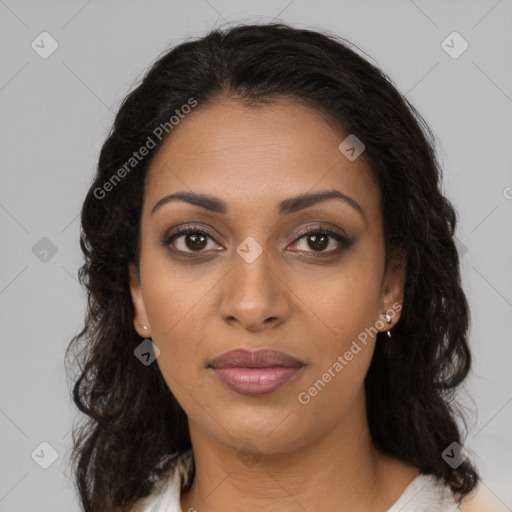 Joyful black young-adult female with long  brown hair and brown eyes