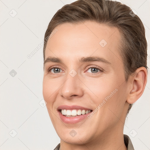 Joyful white young-adult female with short  brown hair and brown eyes