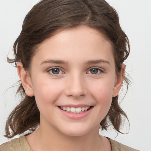 Joyful white child female with medium  brown hair and brown eyes