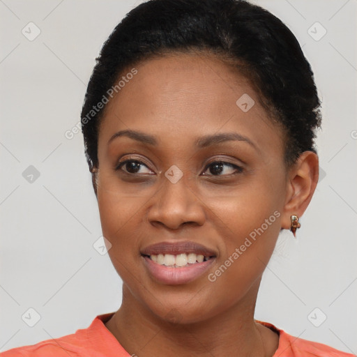 Joyful black young-adult female with short  black hair and brown eyes