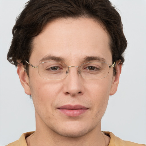 Joyful white adult male with short  brown hair and grey eyes