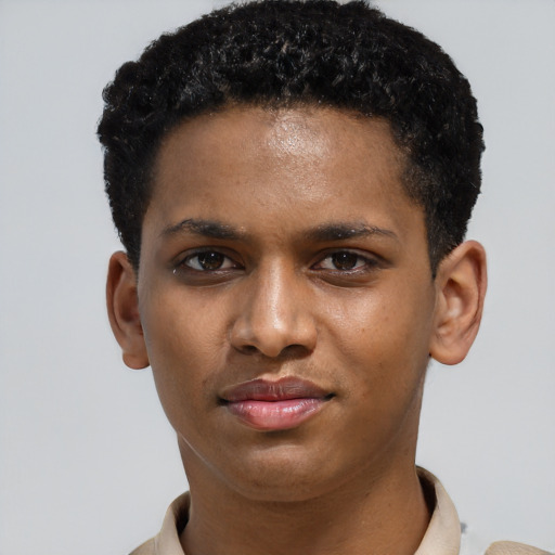 Joyful latino young-adult male with short  brown hair and brown eyes