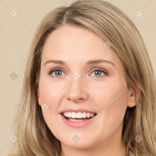 Joyful white young-adult female with long  brown hair and green eyes