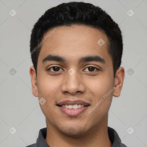 Joyful latino young-adult male with short  black hair and brown eyes