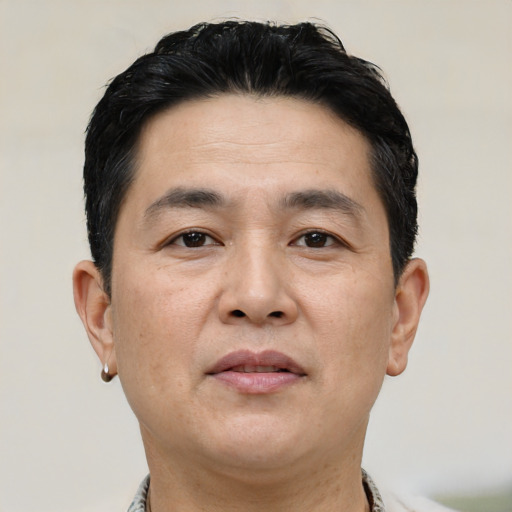 Neutral asian adult male with short  black hair and brown eyes
