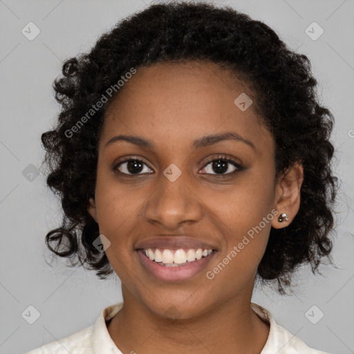 Joyful black young-adult female with medium  brown hair and brown eyes