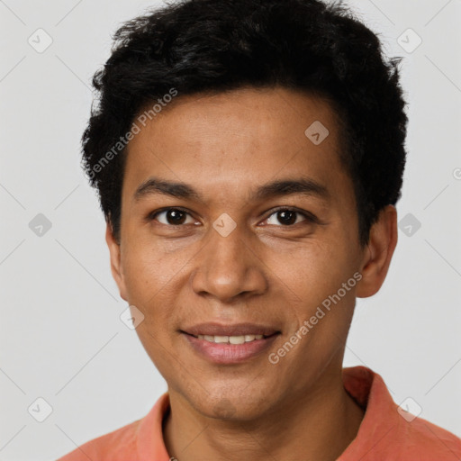 Joyful latino young-adult male with short  brown hair and brown eyes