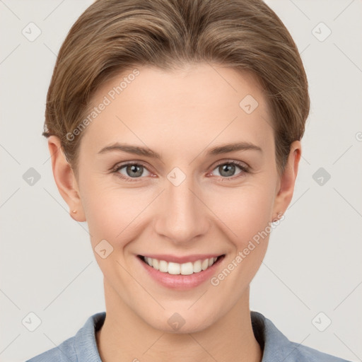 Joyful white young-adult female with short  brown hair and grey eyes