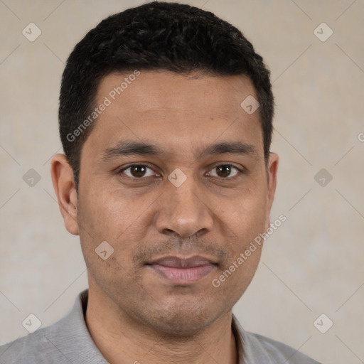 Joyful white young-adult male with short  black hair and brown eyes