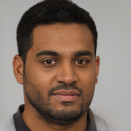 Neutral black young-adult male with short  black hair and brown eyes
