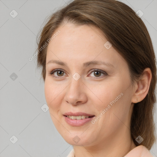 Joyful white adult female with medium  brown hair and brown eyes