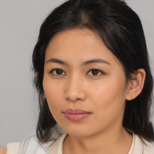 Neutral asian young-adult female with medium  brown hair and brown eyes