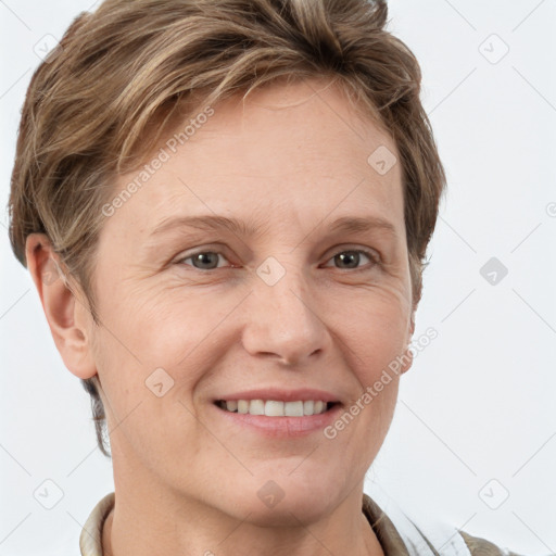 Joyful white adult female with short  brown hair and grey eyes