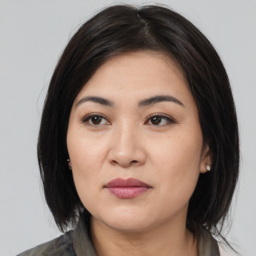 Joyful white young-adult female with medium  black hair and brown eyes