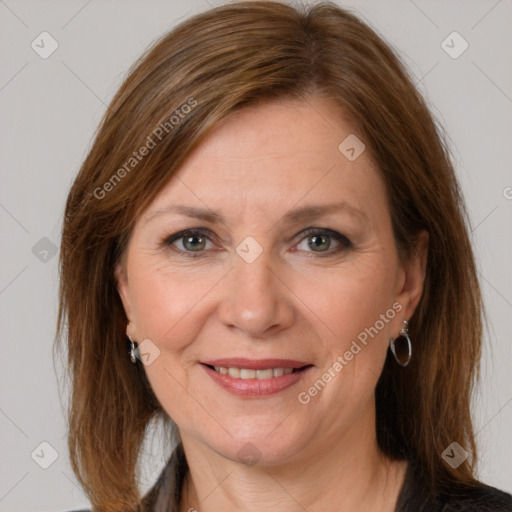 Joyful white adult female with medium  brown hair and grey eyes